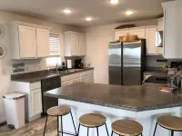 New! 30 seconds from couch to shore, covered front porch w/sunset water views.