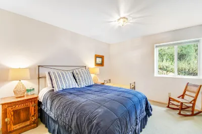 Dog-friendly waterfront home with furnished deck, patio & beach access