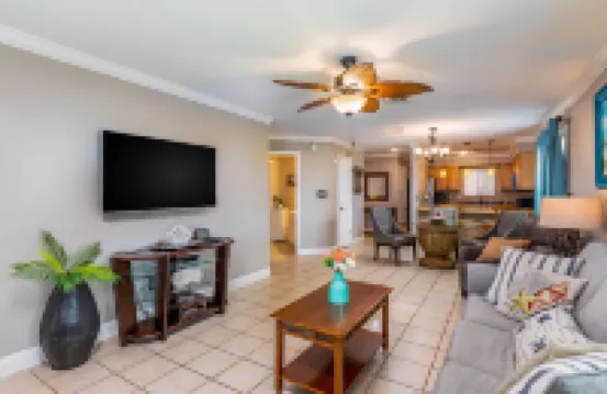 Sound-view beach condo with private balcony, pool, grills, central AC, & W/D