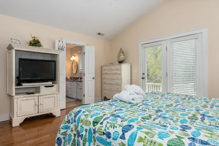 "The Palms" is nestled on a secluded half acre in the forest.  ThePalmsHouse.com