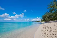 7 Mile Beach Penthouse with Private Beach Club. Ocean views from Roof Terrace.
