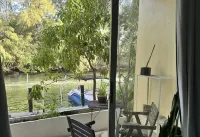 Waterfront Condo with Fishing, Paddleboard, and yard access.