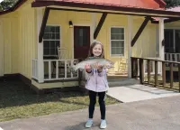 Downtown by Chattahoochee River, sit on front porch as horse and buggy stroll by