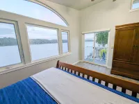 Waterfront Villa with Private Beach, Hot tub, EV & WFH