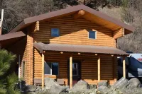 Modern log cabin with a cozy cabin feel along the Clearwater River.