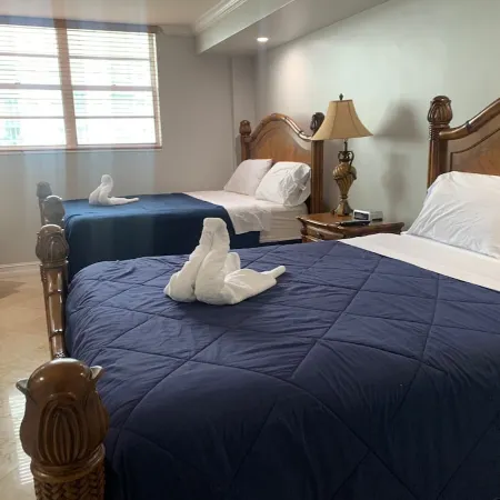 Entire condominium with a pool view, steps from the beach
