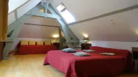 At the foot of the Abbey in the heart of a small village and 9 km from Rouen