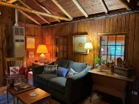 Quaint and cozy log  and knotty pine cabin close to lakes.
