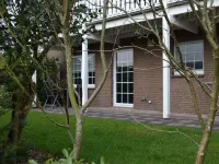 Bright, spacious comfort apartment with private garden and walk-in shower.