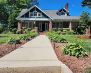 Enjoy small-town, Main Street from the front porch of this historic bungalow! Hotels near Mount Airy Downtown, Inc.