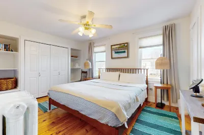 Classic charmer near the coast with with a firepit, outdoor shower, & beach gear