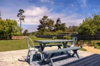 Charming Oasis with Spacious Backyard and Firepit - Delightful Getaway