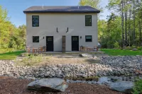 Serene 2-bedroom apartment with WiFi in Ellsworth with a backyard stream.