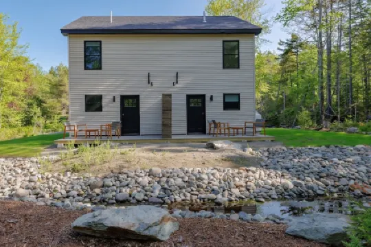 Serene 2-bedroom apartment with WiFi in Ellsworth with a backyard stream.