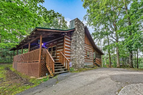 New Song Appalachian Chink Style Cabin Features Foosball and Air Hockey Table by RedAwning