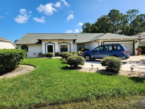 Palm Coast cottage, 3 bedroom 2 bath house w/office,city golf courses and beach.