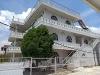 Penginapan Gedung Putih Syariah Hotel dekat Andalas Fried Chicken