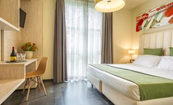 a modern hotel room with a bed , desk , and chair , as well as a window with curtains at Hotel San Marco