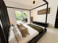 Relajate hermoso jardín y 2 piscinas Hôtels à : Puerto Aventuras