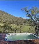 Modern cabin offering incredible views with fire pit, spa and hiking trails.