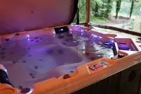 REST ASSURED WITH HOT TUB AND COMFORT OF THIS HOME!