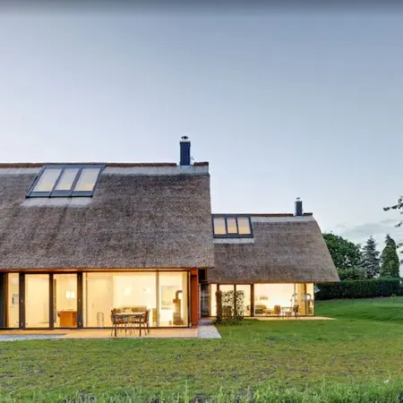 Thatched roof meets modernity, lake view; sauna, garden and much more...