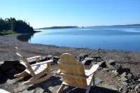 Sea-Breeze Cottage perched on the edge of the bay.