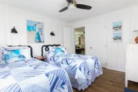 Classic Beach Cottage with front porch view of water