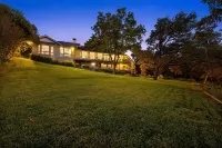 SPECTACULAR LAKEFRONT OASISOver 400 feet frontage on 2 acres of century oaks
