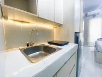 Elegant and Homey Studio at Amartha View Apartment