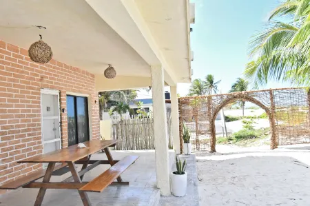 Arena y Mar Beachfront House, El Cuyo by the Spot Rentals