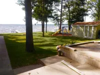 New Listing! Lake front cottage with 100' of private sandy beach