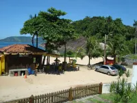 House in front of the beach Sununga, suitable for families. complete structure Hotels in Praia do Lazaro