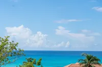 7 Mile Beach Beach Penthouse. Ocean views from Roof Terrace and a Pool Pavilion