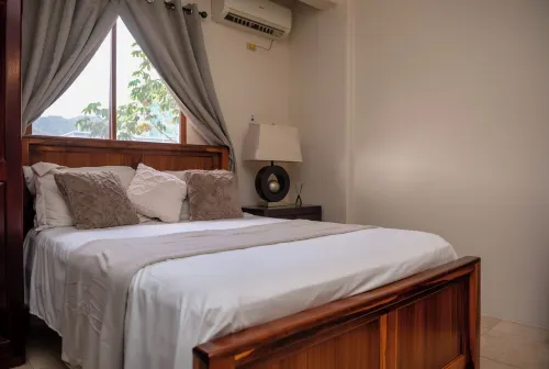 Prime Location + Rooftop Access + City Views + Queens Park Savannah + Walkable