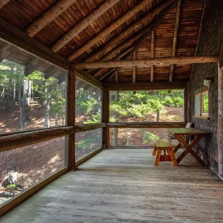 Renovated 3-BR boathouse built atop water in quiet cove; private float & trails