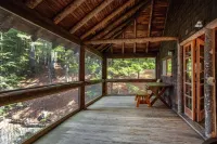 Renovated 3-BR boathouse built atop water in quiet cove; private float & trails - Wifi