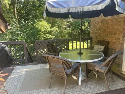 Cozy one level, 2 BR, 2 Bath TH in charming wooded community. Perfect location!