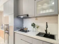 Soft Grey 1BR at Royal Sentul Park Apartment By Travelio