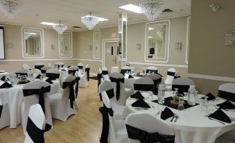 a large banquet hall with numerous tables and chairs set up for a formal event at Causeway Bay Hotel