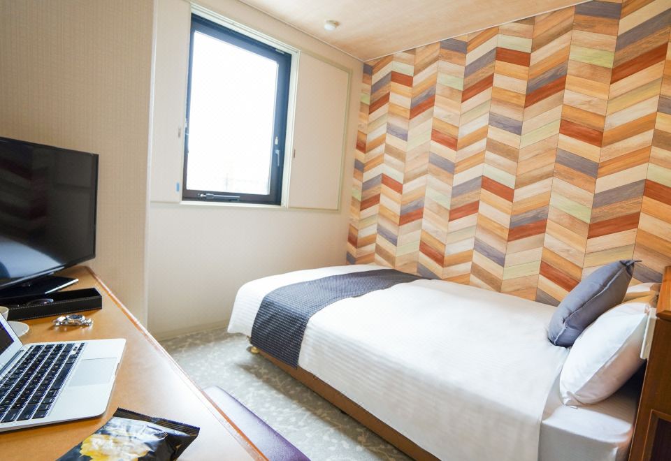 호텔 뉴 가이아 이토시마의 깔끔한 객실 내부