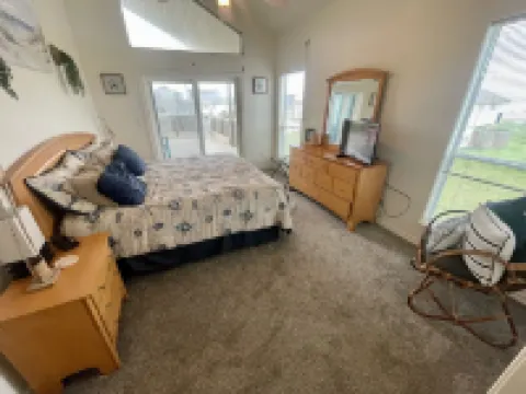 Beach viewing from deck, living, dining, kitchen, in your king size Nectar bed.