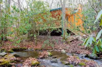 Log cabin nestled in the mountains and situated on Collett Creek