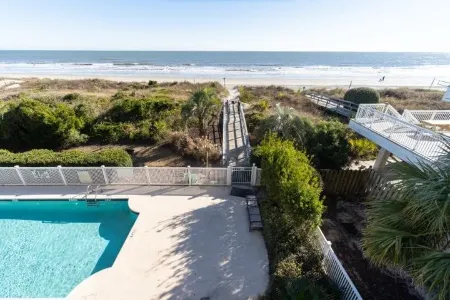 Expansive Deck and Community Swimming Pool - Gorgeous Oceanfront Haven