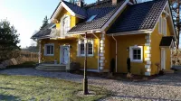 Small yellow villa in Masuria (apartment WEST in the attic) Hotels in 