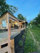 Unplug and unwind in this charming loft cabin nestled on the water’s edge.