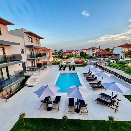 Calma Luxury Suites Отели в г. Неа-Моуданиа