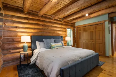 Secluded Log Cabin Retreat on 11 Wooded Acres with Hot Tub & Lake Michigan Views