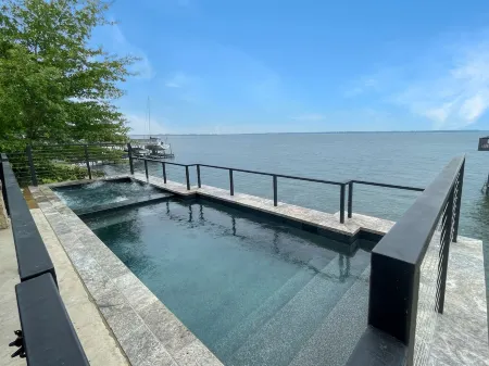 Lake House with pool + hot tub on Golf Course with boat dock