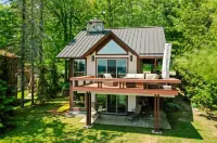 Beautiful Home w/ 2 fireplaces, Deck, and 75ft of Private Higgins Lake Frontage